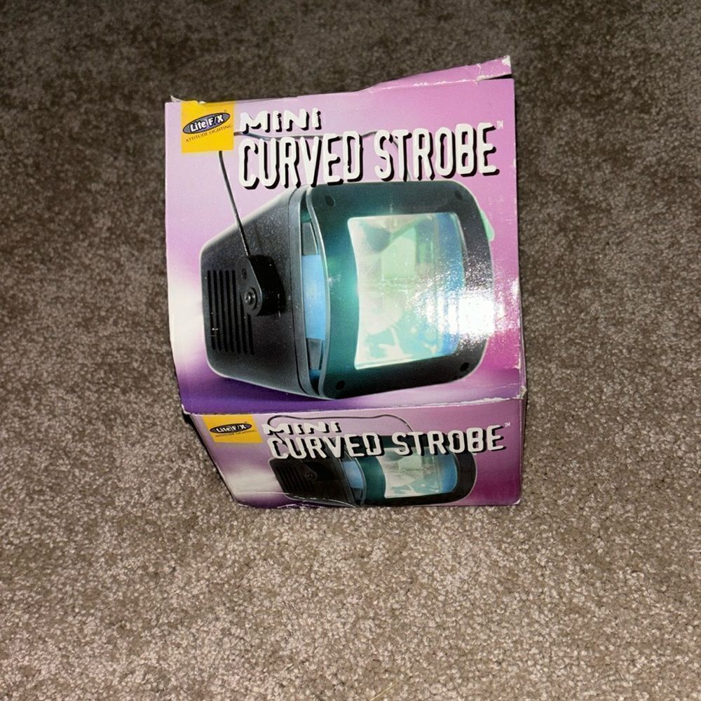 Mini curved strobe with different colored light covers - new in box